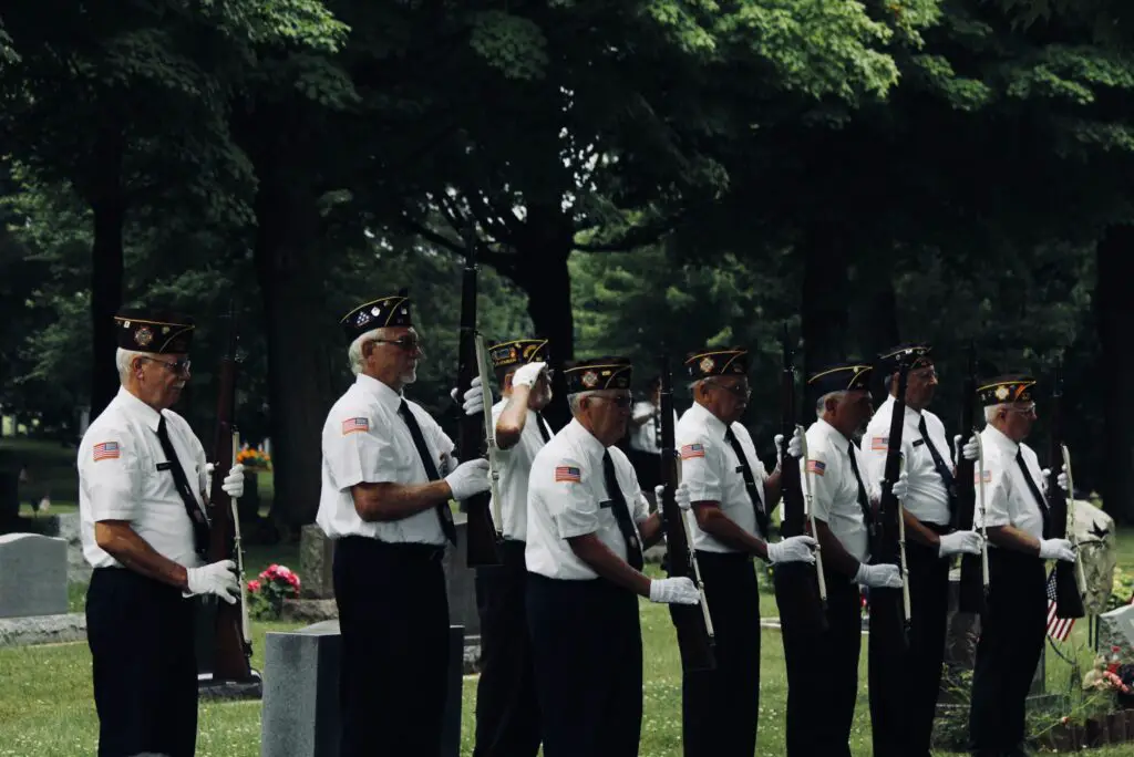 Why do military funerals have a 21-gun salute?